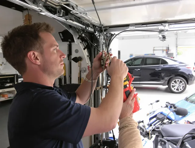 Bluffton Garage Door Repair safety certified technician performing cable replacement in Bluffton