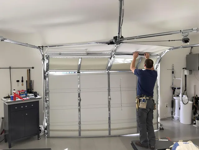 Bluffton Garage Door Repair specialist performing precise section replacement on Bluffton garage door
